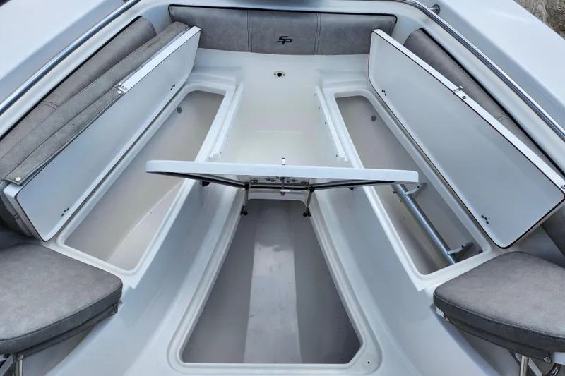 Slide: The Image of 2022 Sea Pro 259 Deep V CC boat interior with open storage compartments. - 18