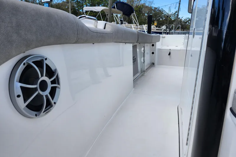 Slide: The Image of 2022 Sea Pro 259 Deep V CC boat interior with cushioned seating and speaker. - 20