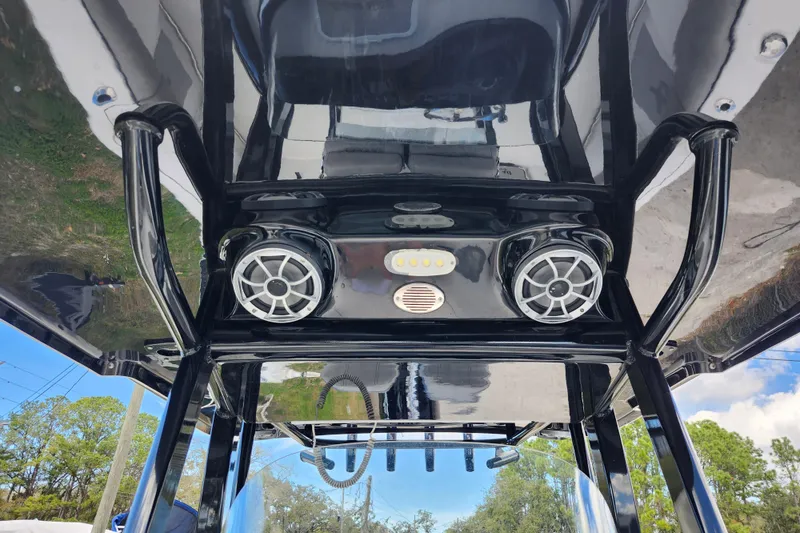 Slide: The Image of 2022 Sea Pro 259 Deep V CC boat speakers and lights on T-top. - 30