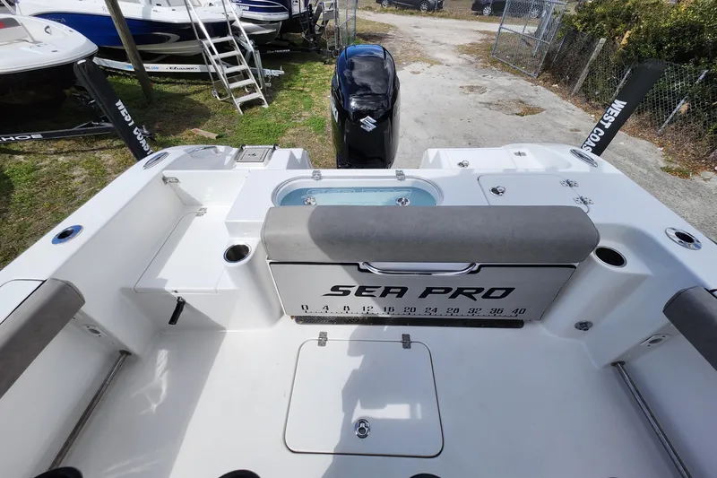 Slide: The Image of 2022 Sea Pro 259 Deep V CC boat interior with seating and storage compartments. - 31