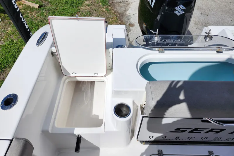 Slide: The Image of 2022 Sea Pro 259 Deep V CC boat interior with storage compartments and seating. - 35