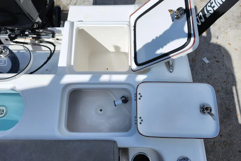 Slide: The Image of 2022 Sea Pro 259 Deep V CC boat with open storage compartments and livewell. - 37
