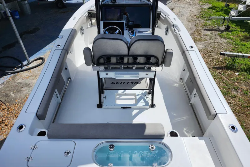 Slide: The Image of 2022 Sea Pro 259 Deep V CC boat interior with seating and console. - 39
