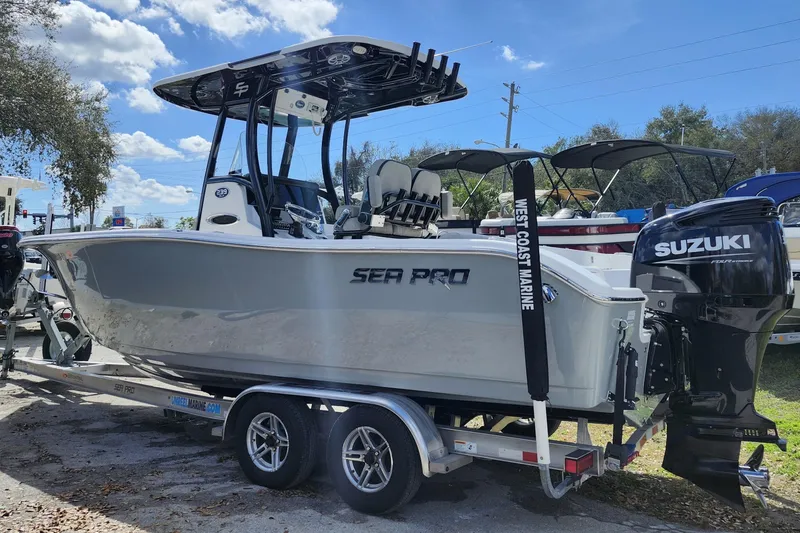 Slide: The Image of 2022 Sea Pro 259 Deep V CC boat on trailer with Suzuki outboard motor. - 4