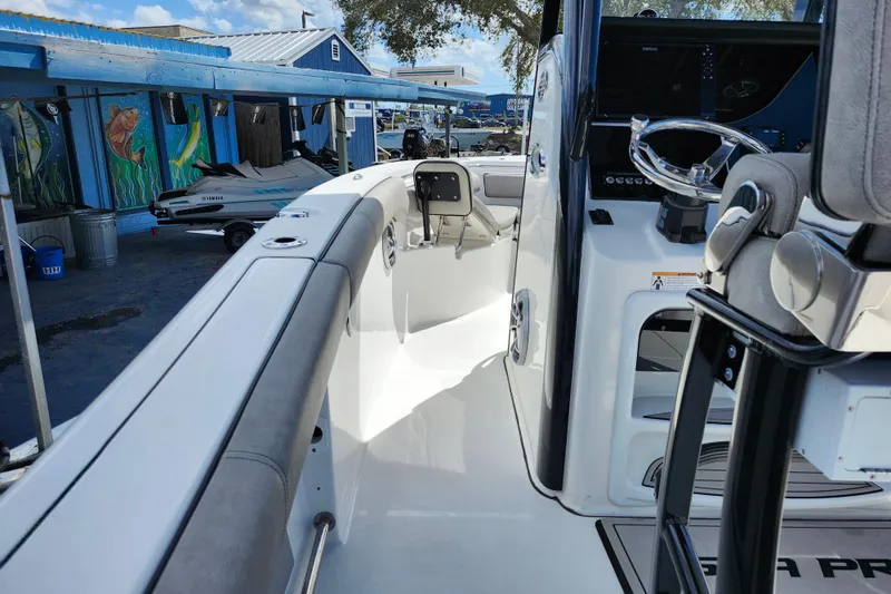 Slide: The Image of 2022 Sea Pro 259 Deep V CC boat interior with steering wheel and seating. - 42