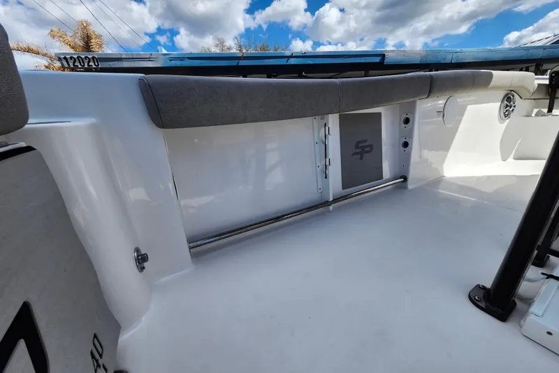Slide: The Image of 2022 Sea Pro 259 Deep V CC boat interior with cushioned seating and storage. - 44