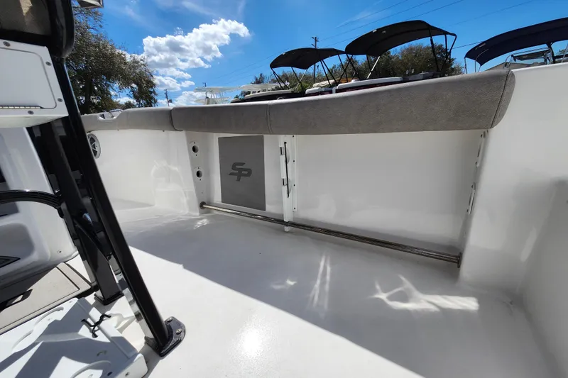 Slide: The Image of 2022 Sea Pro 259 Deep V CC boat interior with cushioned seating and storage. - 45