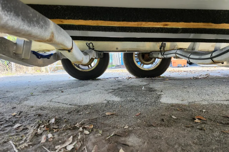 Slide: The Image of Underneath view of a 2022 Sea Pro 259 Deep V CC boat trailer. - 7