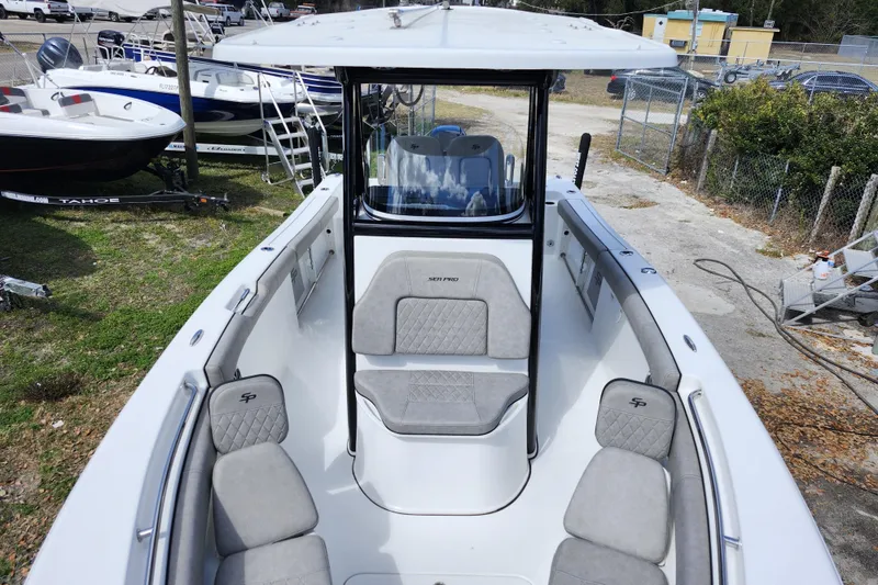 Slide: The Image of 2022 Sea Pro 259 Deep V CC boat with spacious seating and modern design. - 9