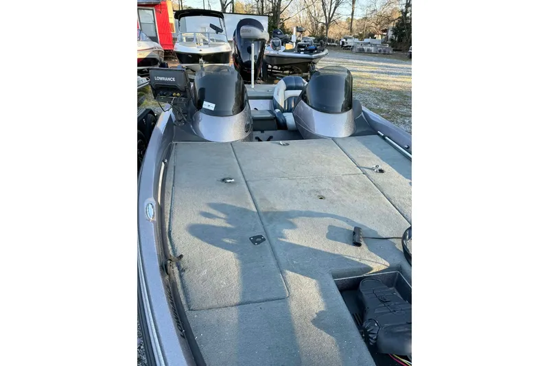 Slide: The Image of 2008 Stratos 294 XL boat interior with Lowrance equipment, parked outdoors. - 4