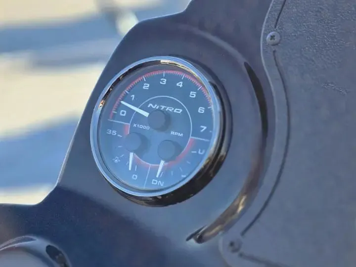 Slide: The Image of Close-up of a Nitro Z17 tachometer, model year 2026. - 17