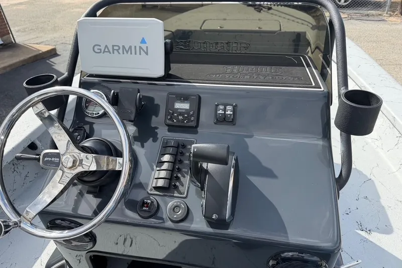 Slide: The Image of 2025 Haynie 23 Magnum boat console with Garmin GPS and control panel. - 10