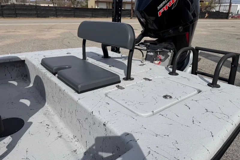 Slide: The Image of 2025 Haynie 23 Magnum boat interior with seating and Mercury Pro XS engine. - 13