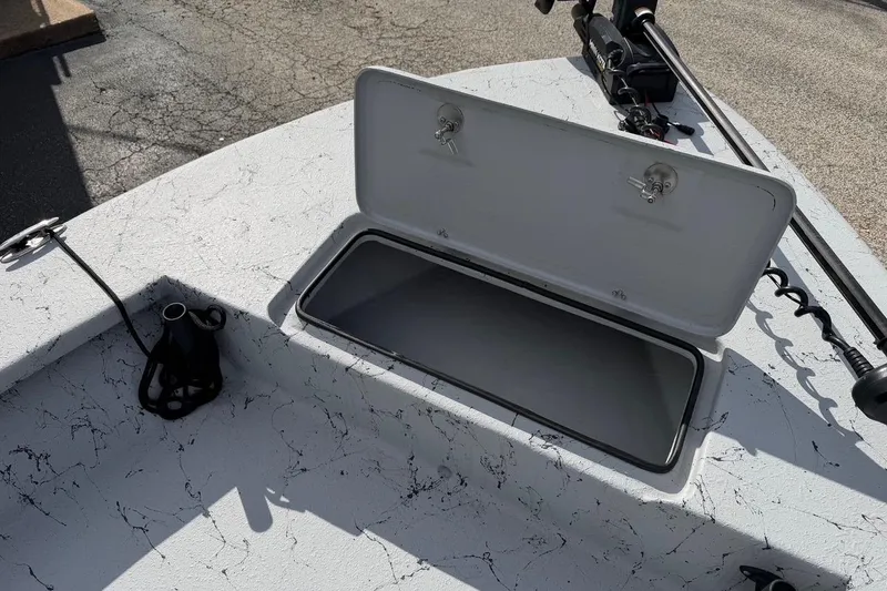Slide: The Image of Open storage compartment on 2025 Haynie 23 Magnum boat deck. - 14