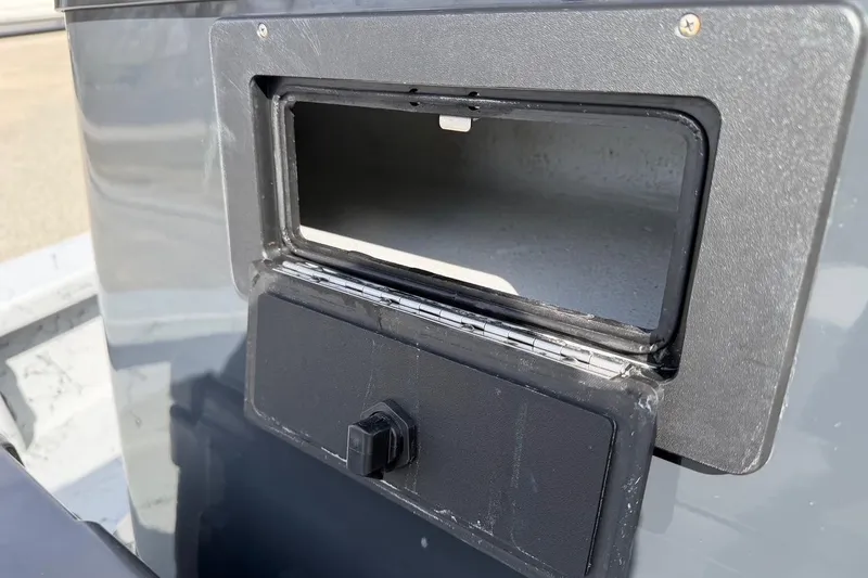 Slide: The Image of Open storage compartment on 2025 Haynie 23 Magnum boat. - 16