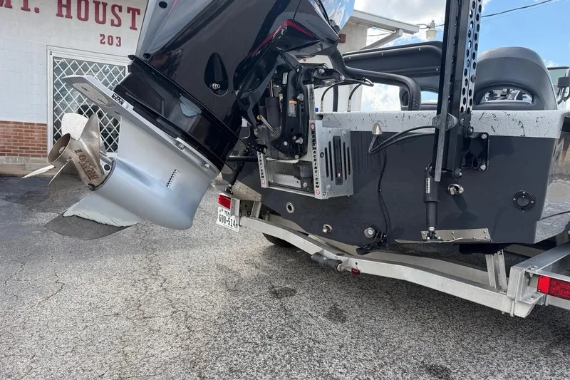 Slide: The Image of 2025 Haynie 23 Magnum boat with powerful outboard motor on trailer. - 4