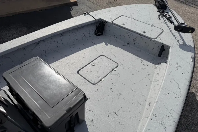 Slide: The Image of 2025 Haynie 23 Magnum boat deck with storage compartments and equipment. - 7