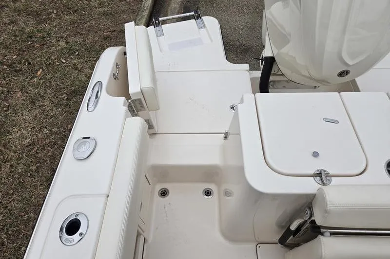 Slide: The Image of 2026 Grady-White Fisherman 236 boat deck with storage compartments and seating. - 10