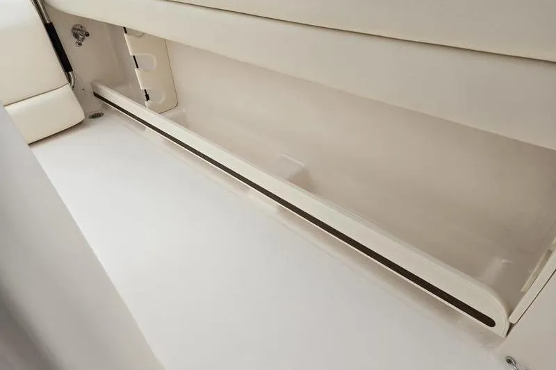 Slide: The Image of 2026 Grady-White Fisherman 236 interior storage compartment, featuring sleek design and ample space. - 11