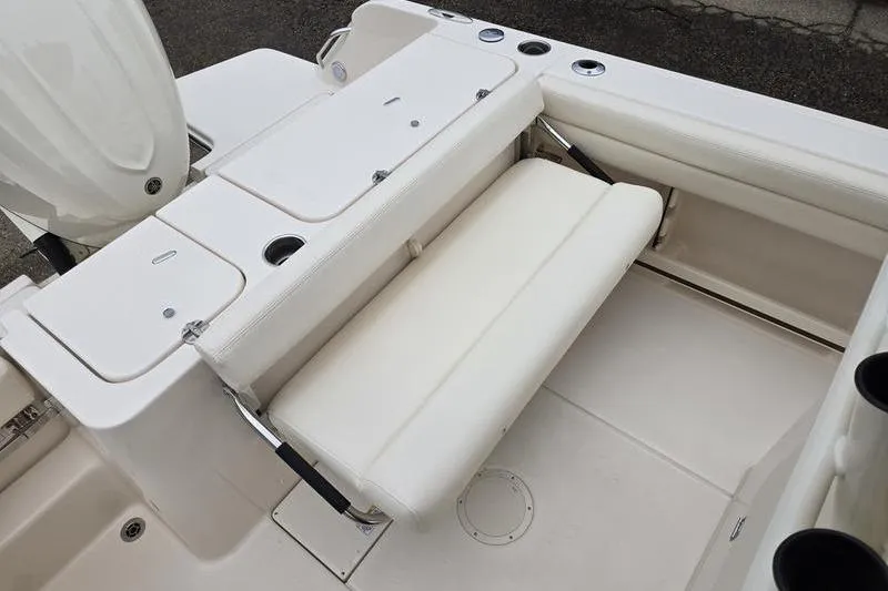 Slide: The Image of 2026 Grady-White Fisherman 236 boat interior with foldable seating and storage compartments. - 15