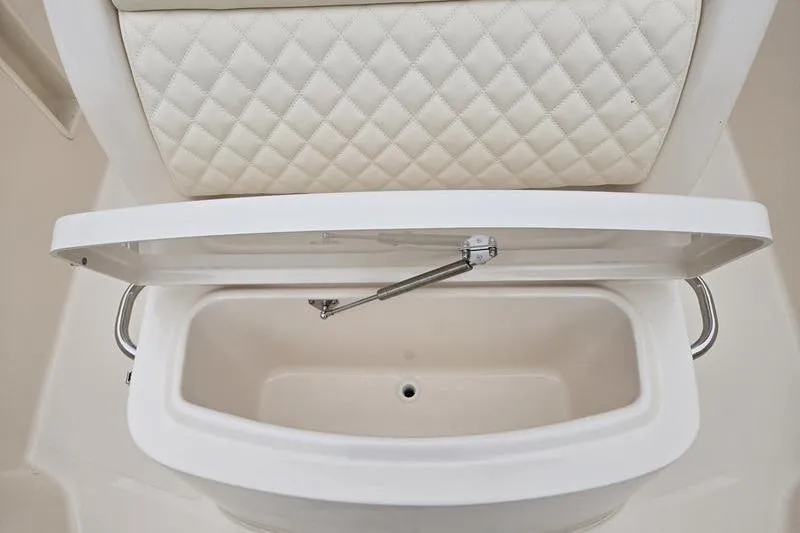 Slide: The Image of 2026 Grady-White Fisherman 236 boat storage compartment with cushioned seat. - 16