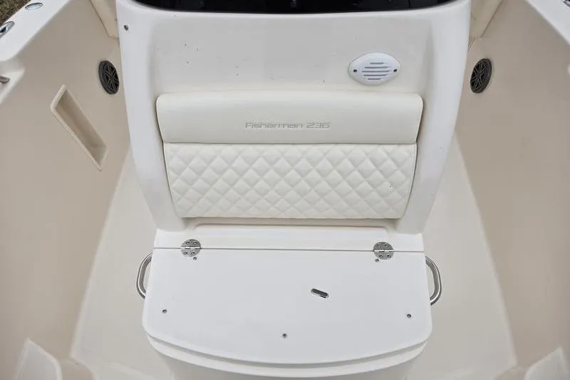 Slide: The Image of 2026 Grady-White Fisherman 236 boat interior with cushioned seating and storage. - 17