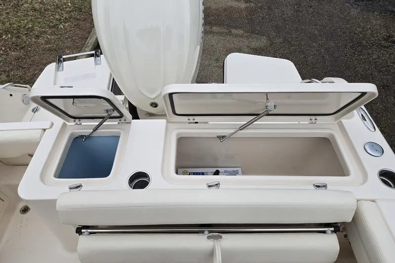 Slide: The Image of 2026 Grady-White Fisherman 236 boat with open storage compartments and seating. - 3