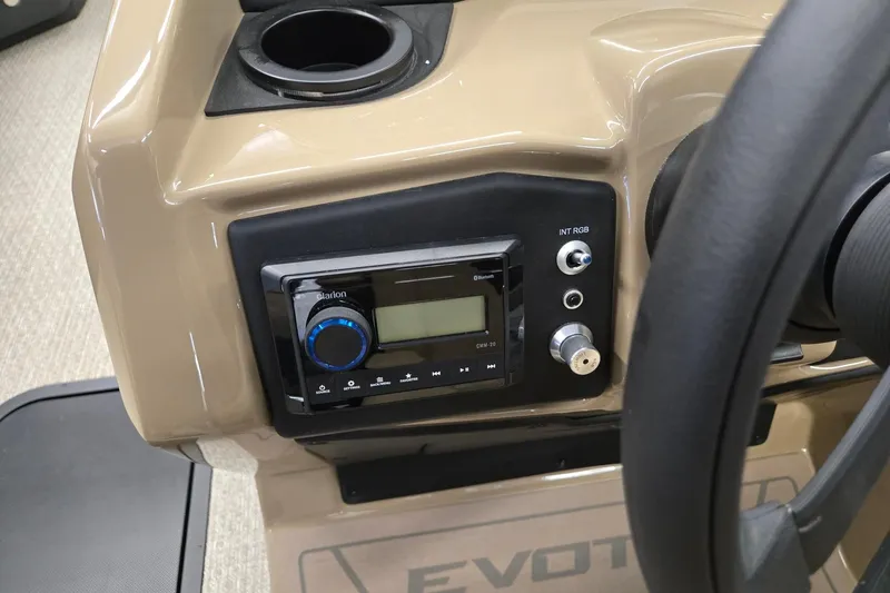 Slide: The Image of Dashboard of 2026 Evotti 521QL featuring audio controls and cup holder. - 12