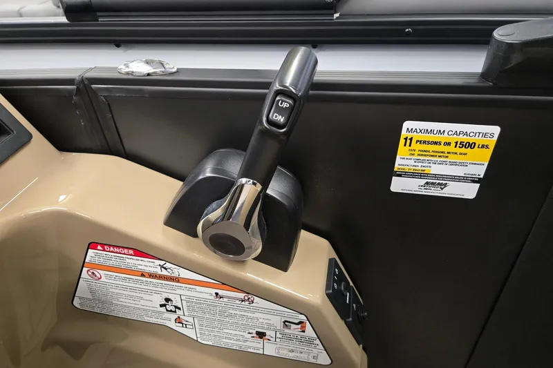 Slide: The Image of Throttle control and capacity label on 2026 Evotti 521QL boat dashboard. - 14