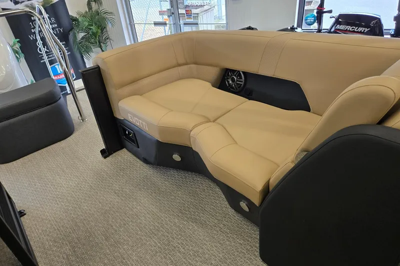 Slide: The Image of Luxurious Evotti 521QL 2026 boat seating with tan upholstery and integrated speaker system. - 16