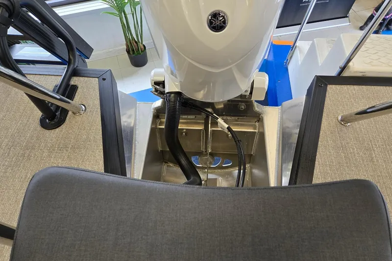 Slide: The Image of 2026 Evotti 521QL boat interior with motor and seating area. - 23