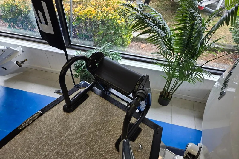 Slide: The Image of Evotti 521QL treadmill in a bright room with plants, 2026 model. - 24