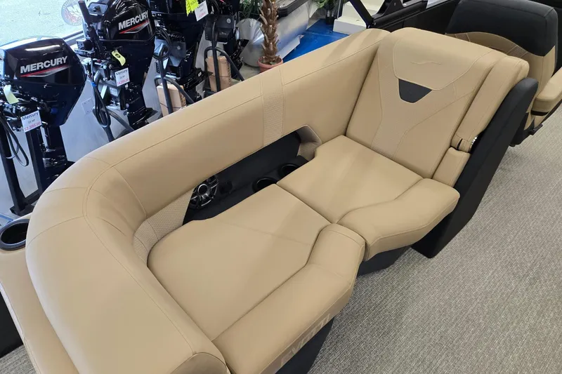Slide: The Image of Luxurious beige seating in a 2026 Evotti 521QL boat, with Mercury outboard motors in the background. - 26