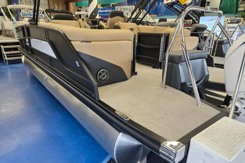 Slide: The Image of 2026 Evotti 521QL pontoon boat with beige seating and sleek black exterior. - 3