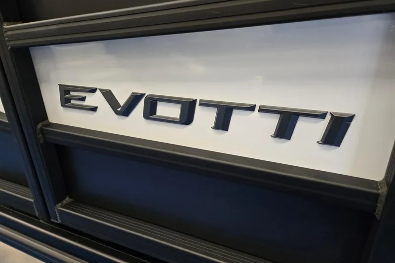 Slide: The Image of Evotti 521QL 2026 logo on sleek black and white vehicle surface. - 35
