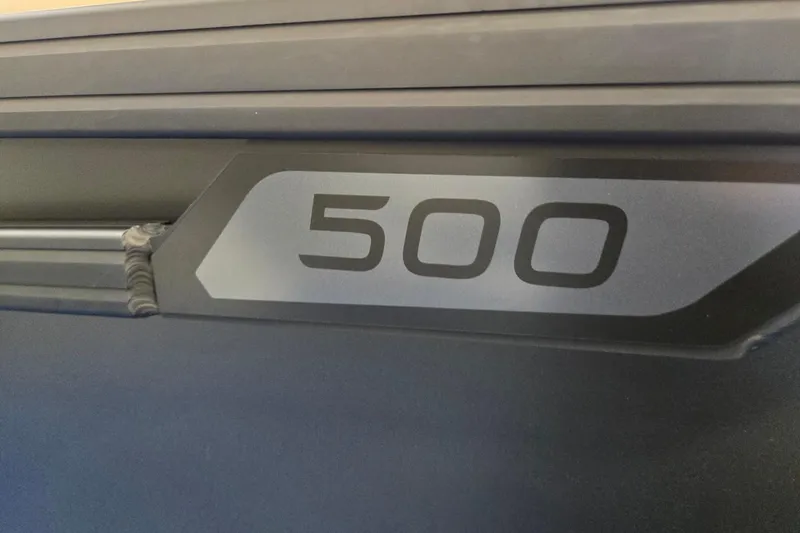 Slide: The Image of Close-up of Evotti 521QL 2026 model with "500" label on dark surface. - 36