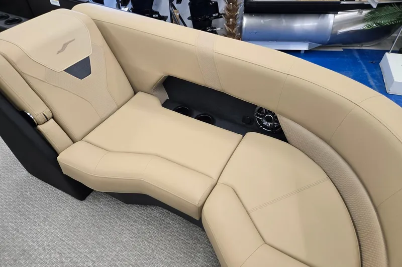 Slide: The Image of Luxurious beige seating in 2026 Evotti 521QL boat, featuring cup holders and modern design. - 6