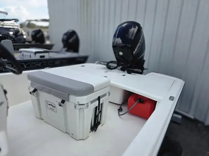 Slide: The Image of Mako Pro Skiff 17 CC 2026 with outboard motor and bench seat. - 11