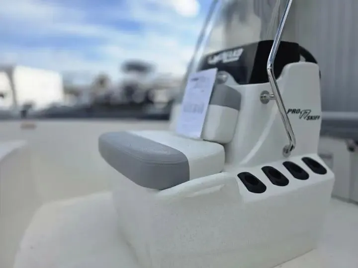 Slide: The Image of Close-up of the helm of a 2026 Mako Pro Skiff 17 CC. - 12