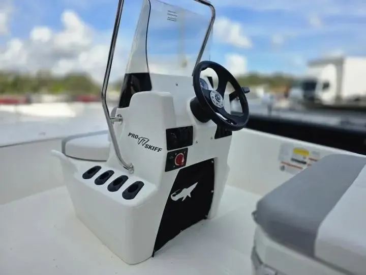 Slide: The Image of 2026 Mako Pro Skiff 17 CC steering console with wheel. - 14