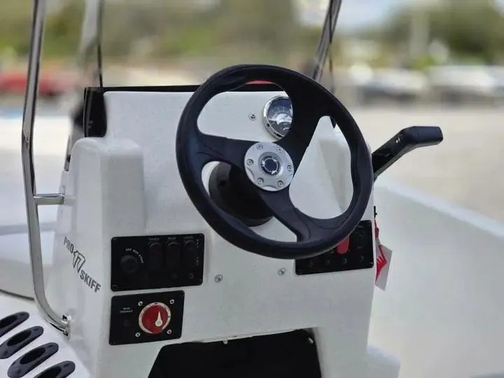 Slide: The Image of Steering console of the 2026 Mako Pro Skiff 17 CC. - 15