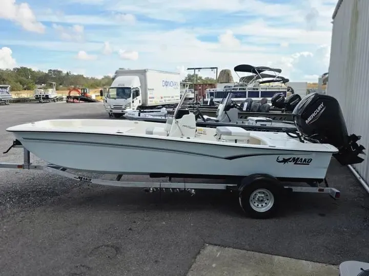 Slide: The Image of 2026 Mako Pro Skiff 17 CC parked outdoors on trailer. - 3