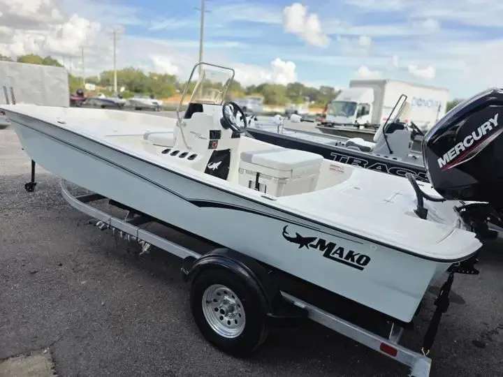 Slide: The Image of 2026 Mako Pro Skiff 17 CC on trailer, side view. - 4