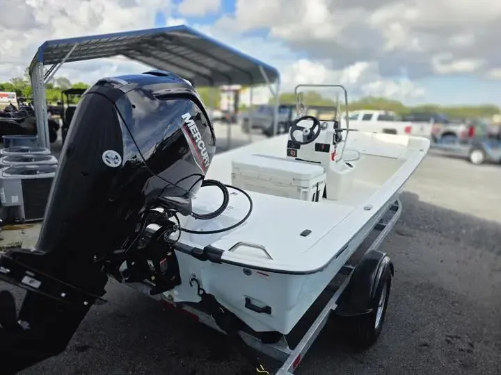 Slide: The Image of 2026 Mako Pro Skiff 17 CC with Mercury engine on trailer. - 5