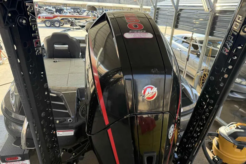 Slide: The Image of 2023 Nitro Z20 Pro boat with powerful engine and Raptor mounts in a marina setting. - 4