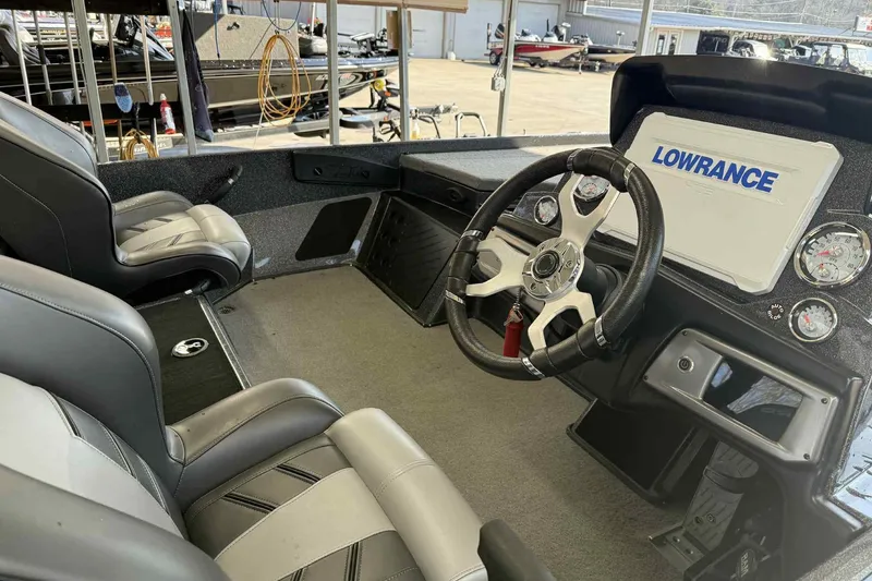 Slide: The Image of Interior of 2023 Nitro Z20 Pro boat with steering wheel and Lowrance display. - 7