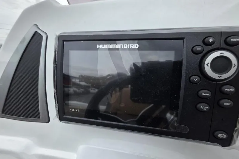 Slide: The Image of Humminbird Helix 5 fish finder on 2026 Xpress H20CC boat dashboard. - 15