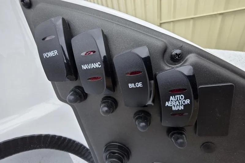 Slide: The Image of Control panel of 2026 Xpress H20CC boat with labeled switches. - 17