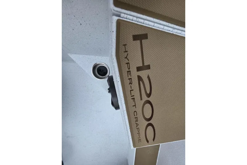 Slide: The Image of 2026 Xpress H20CC Hyper-Lift Crappie boat detail with textured surface. - 26