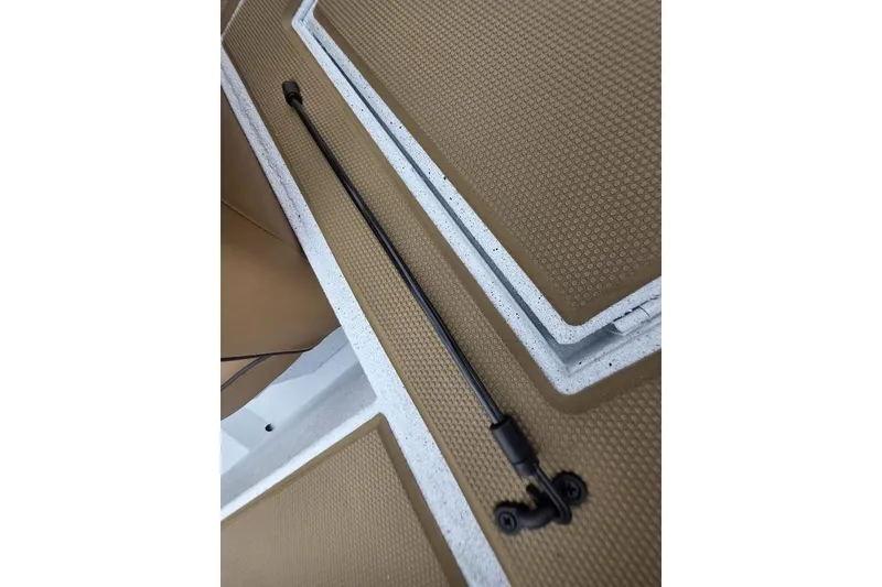 Slide: The Image of 2026 Xpress H20CC boat compartment with hydraulic lift support. - 27